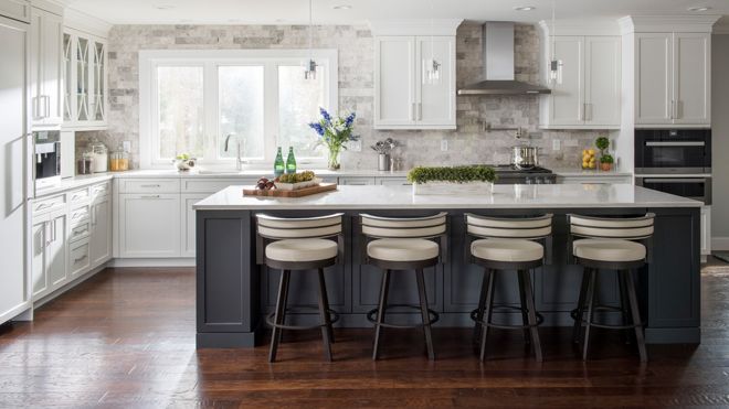 Open kitchen with white cabinets and island